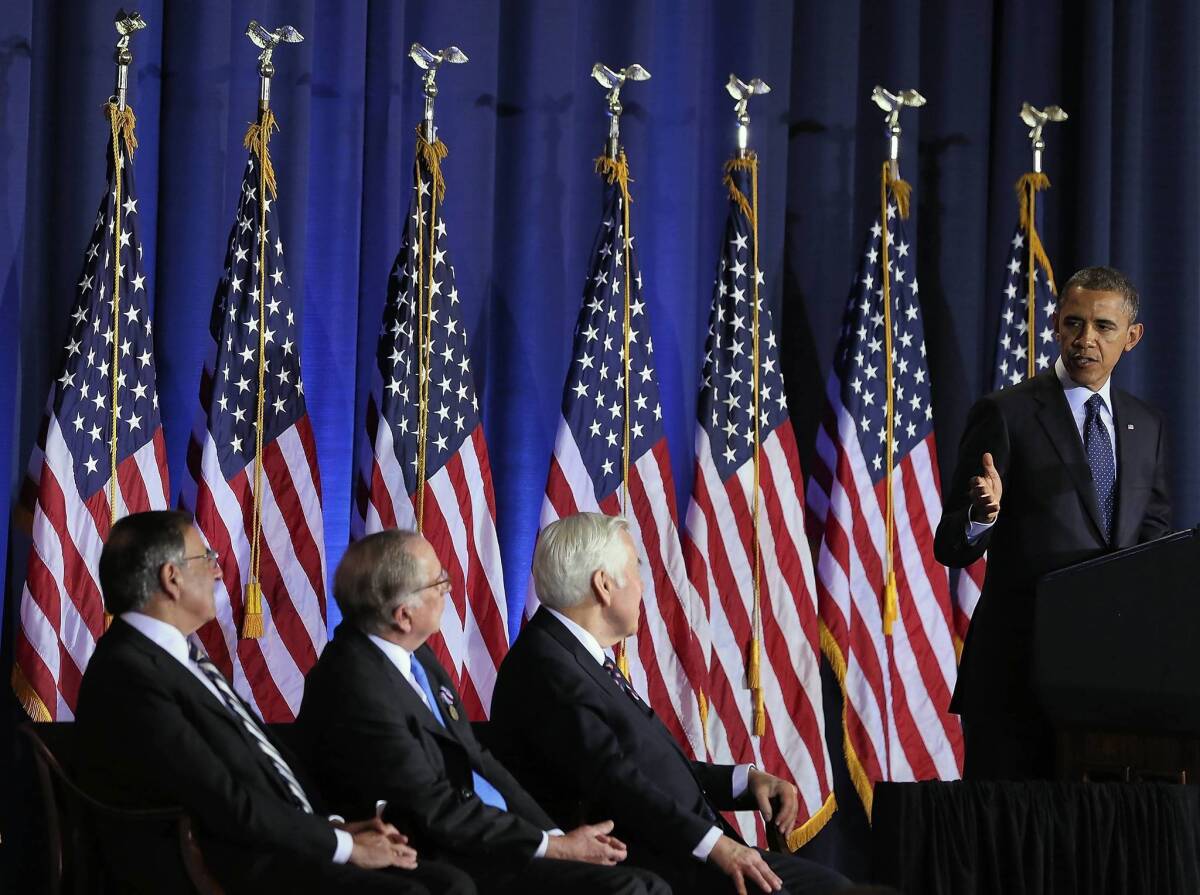 President Obama speaks at an arms control symposium at the National War College in Washington as Secretary of Defense Leon E. Panetta, left, former Sen. Sam Nunn (D-Ga.) and Sen. Richard G. Lugar (R-Ind.) look on.
