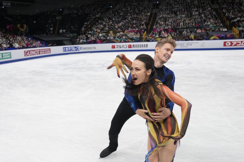 Madison Chock and Evan Bates of the U.S. perform during the ice dance free dance program in the World Figure Skating Championships in Saitama, north of Tokyo, Saturday, March 25, 2023. (AP Photo/Hiro Komae)