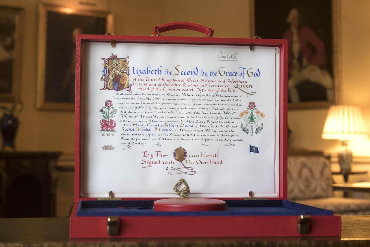 Prince Harry and Meghan Markle's Instrument of Consent document, signed by Queen Elizabeth II, on display at Buckingham Palace.