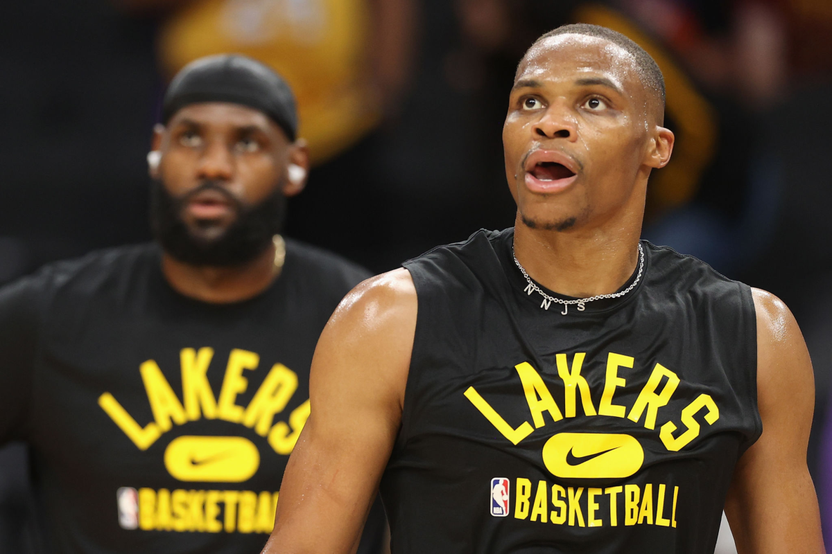 Russell Westbrook, right, and LeBron James warm up for the Lakers before a preseason game against the Phoenix Suns.