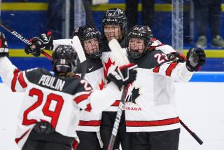 The players of Canada celebrate after Brianne Jenner has scored their second goal.