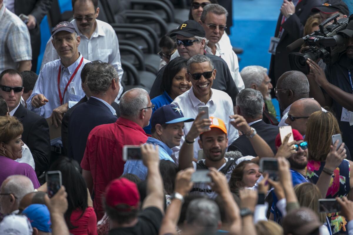 President Barack Obama mixes with the baseball fans at the Cuba-Tampa Bay Rays matchup.
