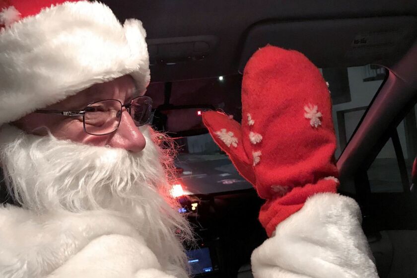 A Lyft driver in San Francisco delivering some yule time cheer from the driver's seat. (Robin Abcarian / Los Angeles Times)