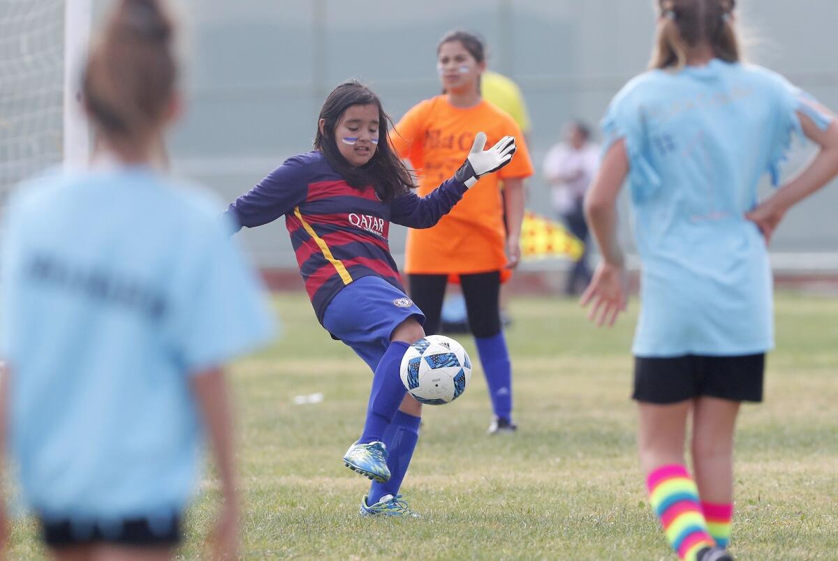 Wilson Elementary goalkeeeper Emily Ebergenyi kicks the ball down the field against St. Joachim Catholic in a girls’ third- and fourth-grade Bronze Division pool-play match at the Daily Pilot Cup on Friday at Costa Mesa High.
