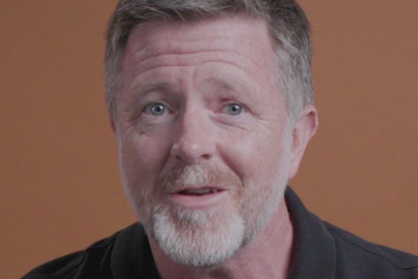 A reporter speaking to a camera in a studio.