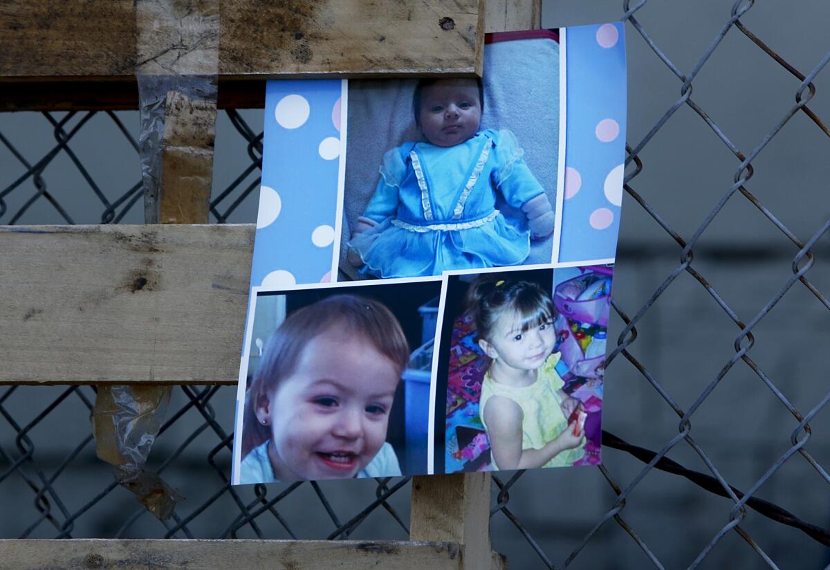 A photo of the three slain Coronado girls is displayed during a memorial vigil in 2014 are Xenia, 2 months, top; Sophia, 2, bottom right; Yazmine, 16 months, bottom left.