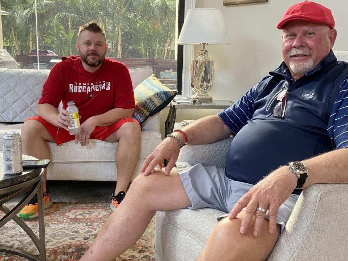 Buccaneers coach Bruce Arians sits in his Tampa home with son Jake the morning after winning Super Bowl LV.
