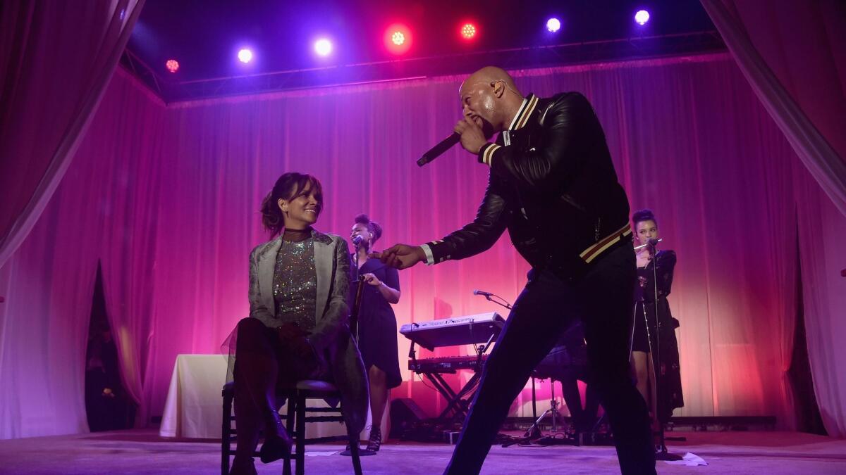 Halle Berry and Common perform onstage at the 16th Annual Chrysalis Butterfly Ball on June 3 in Los Angeles.