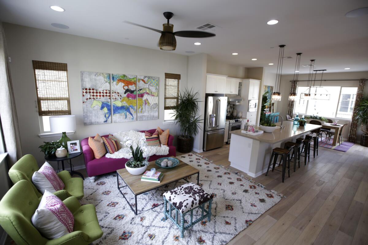 The kitchen and living room of a model home at MBK Homes' new Anaheim community named Anacasa.