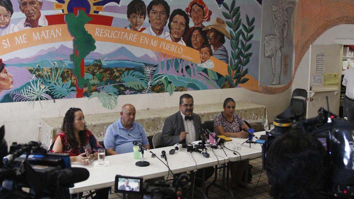 Pediatricians speak to reporters on Tuesday about their experiences treating migrant children in a network of shelters run by Annunciation House in El Paso.