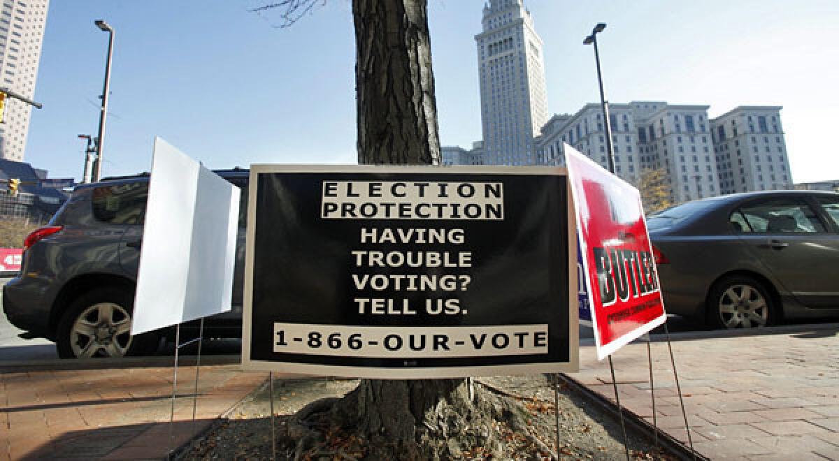 A sign advertising the protection of voter rights is posted outside a polling site in Cleveland. A county in Alabama is challenging a provision that requires much of the South to get advance approval from Washington before making changes in election laws or voting rules.