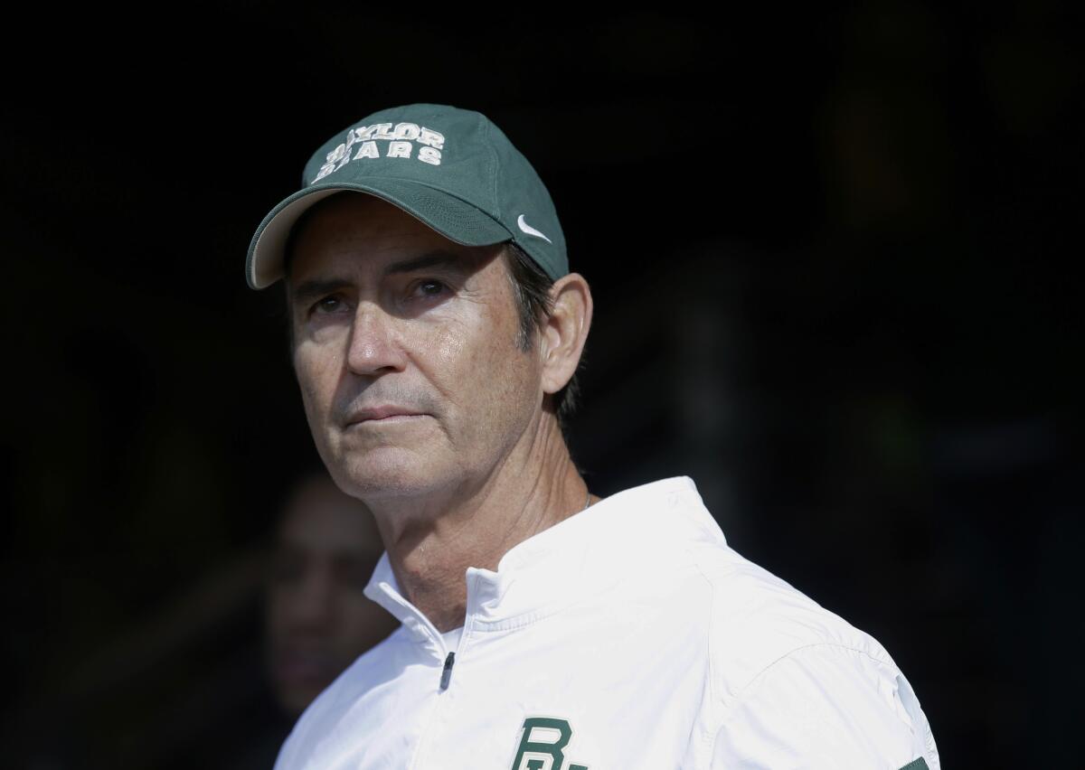 FILE - In this Dec. 5, 2015, file photo, Baylor coach Art Briles stands in the tunnel before the team's NCAA college football game against Texas in Waco, Texas. The NCAA infractions committee said Wednesday, Aug. 11, 2021, that its years-long investigation into the Baylor sexual assault scandal would result in four years probation and other sanctions, though the “unacceptable” behavior at the heart of the case did not violate NCAA rules. The NCAA ruling came more than five years after the scandal broke at the world’s largest Baptist university, leading to the firing of successful football coach Art Briles, and the later departures of athletic director Ian McCaw and school president Ken Starr.(AP Photo/LM Otero, File)