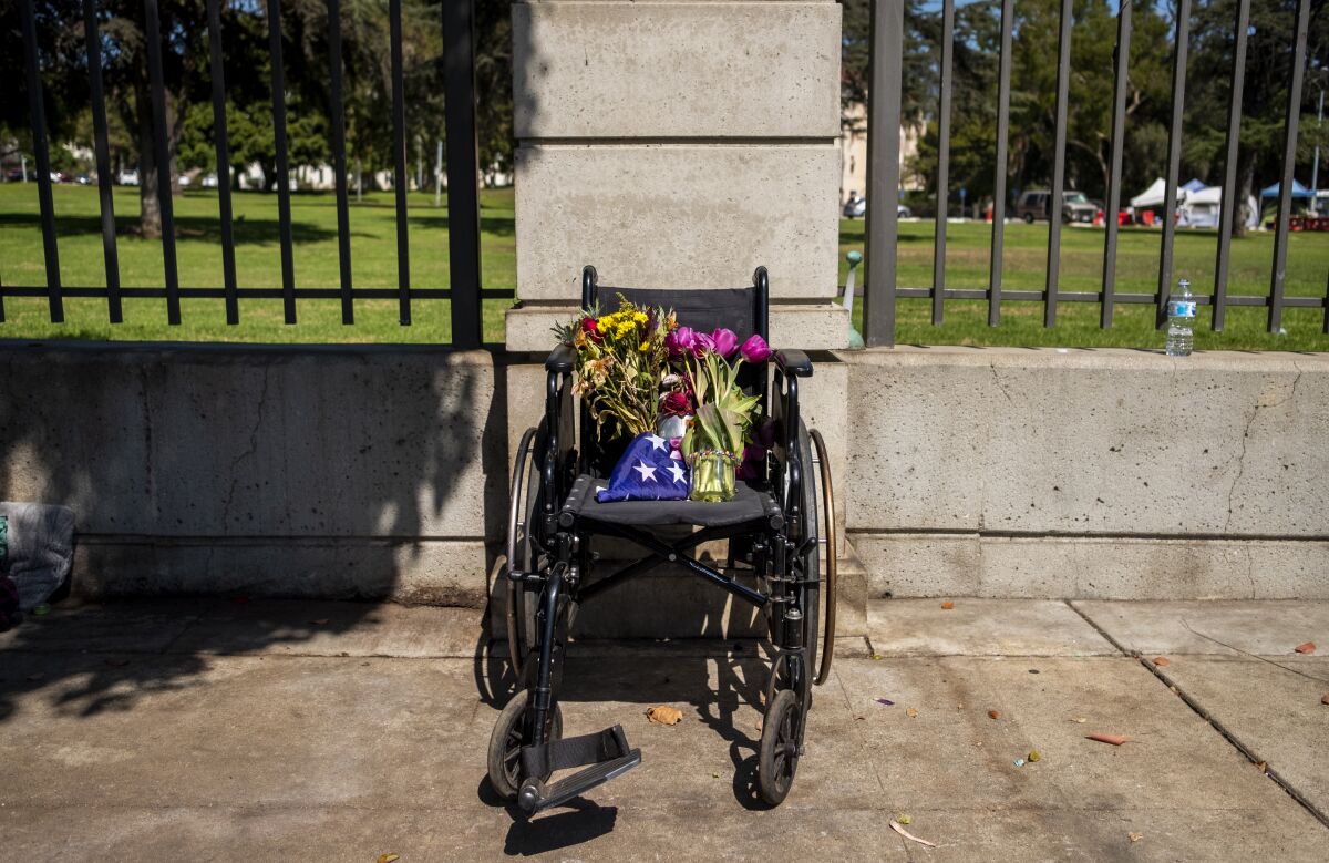 Flowers are left in a wheelchair.