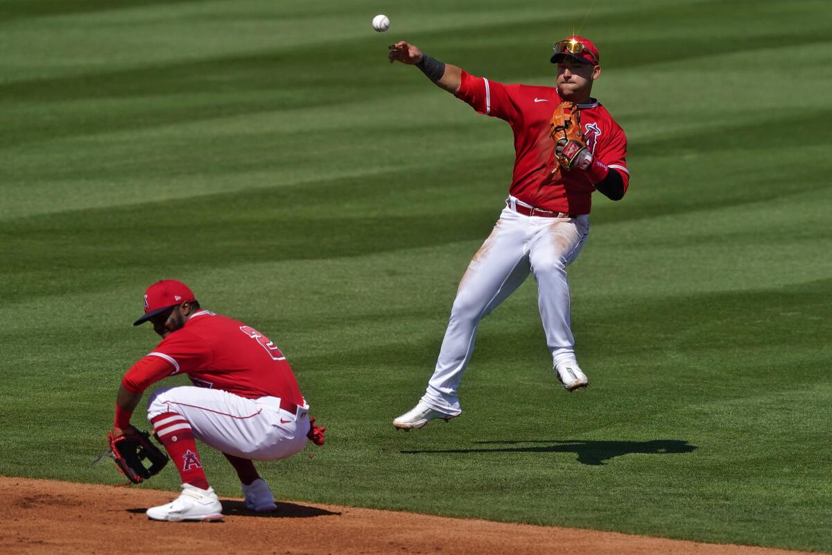 Los Angeles Angels' Jose Iglesias fields a base hit during a spring training baseball game.