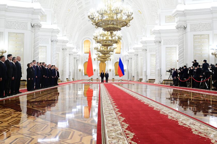 Russian President Vladimir Putin, foreground right, and Chinese President Xi Jinping, foreground left, attend an official welcome ceremony at The Grand Kremlin Palace, in Moscow, Russia, Tuesday, March 21, 2023. (Pavel Byrkin, Sputnik, Kremlin Pool Photo via AP)