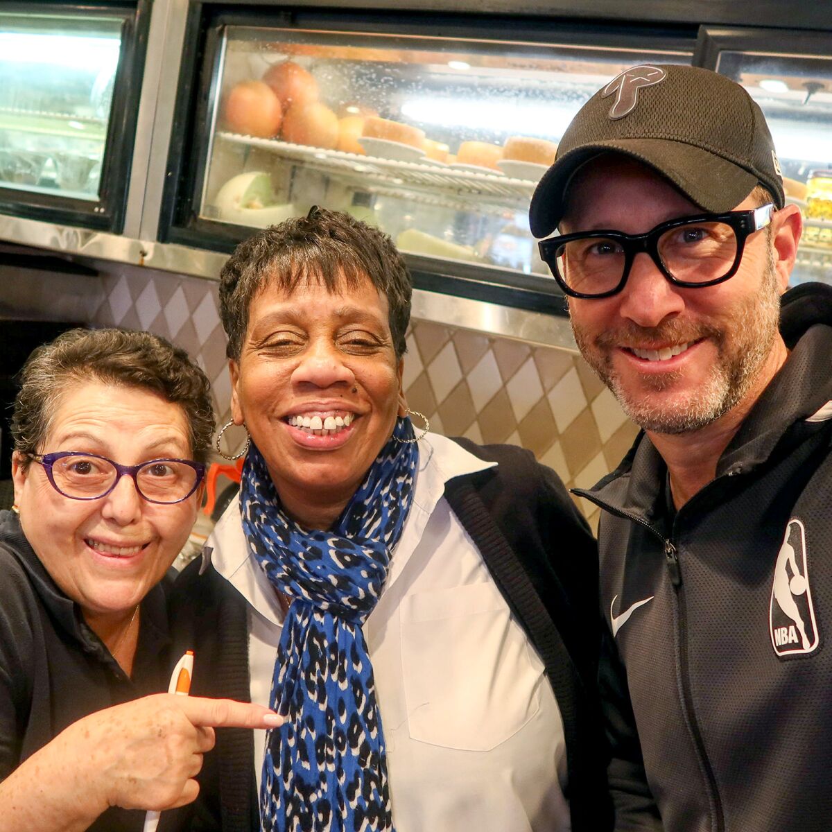 Nate ’n Al's waitress Gloria Leon, hostess Angela Patterson and William Morris Endeavor partner Richard Weitz.