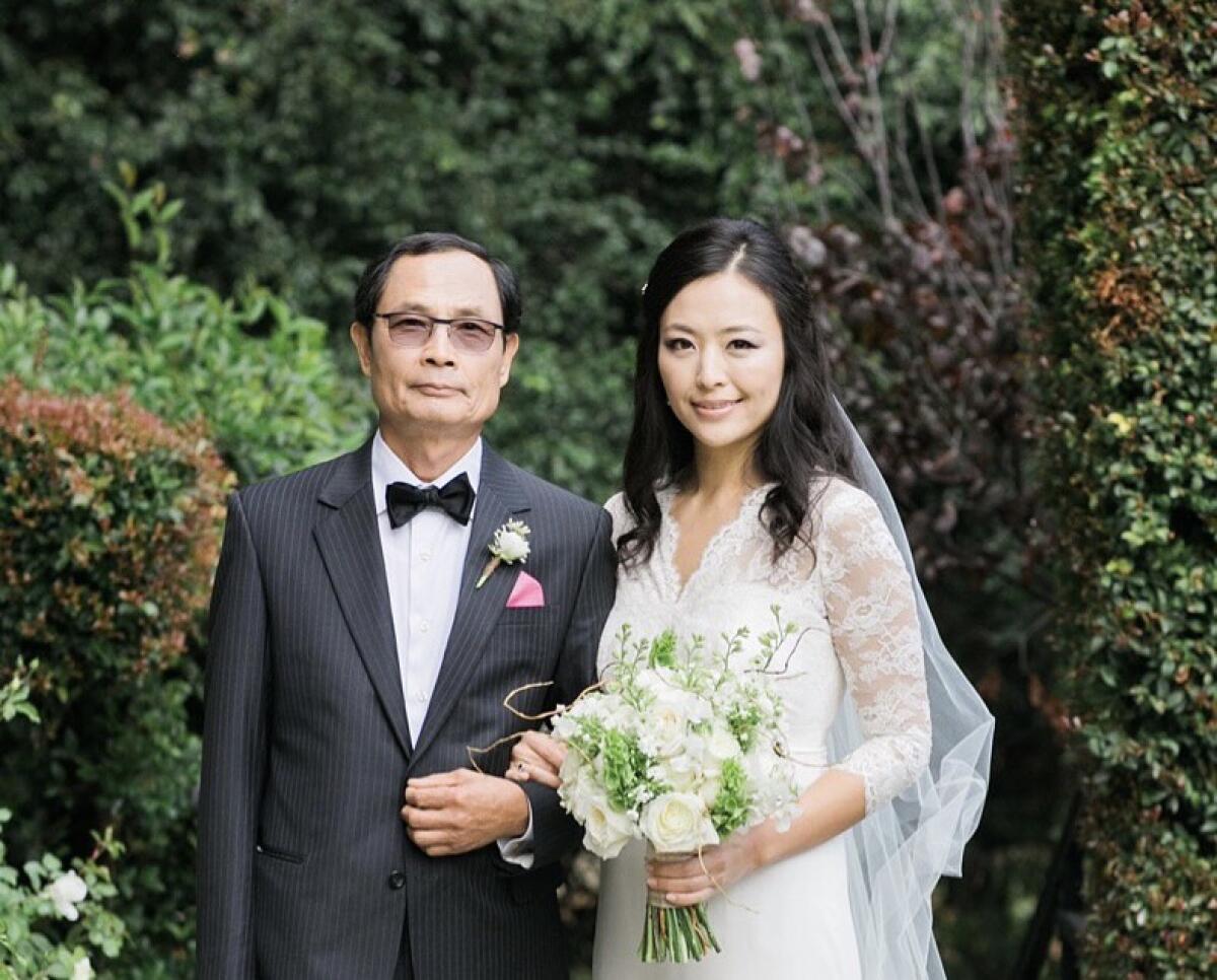 Dal Keun Lee, 70, left, with his daughter Cathy at her wedding.