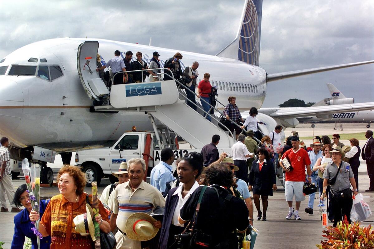 The first passengers of the first flight of Continental Airlines from Miami arrives at the Jose Marti Airport of Havana on Nov. 1, 2001. The United States and Cuba have reached an understanding on restoring regularly scheduled commercial flights.