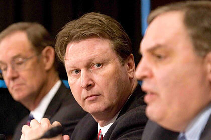 "The only way were going to be successful is to truly mount a comprehensive attack upon the cartels," said Arizona Atty. Gen. Terry Goddard, left, with Justice Department officials William Hoover and Anthony Placido.