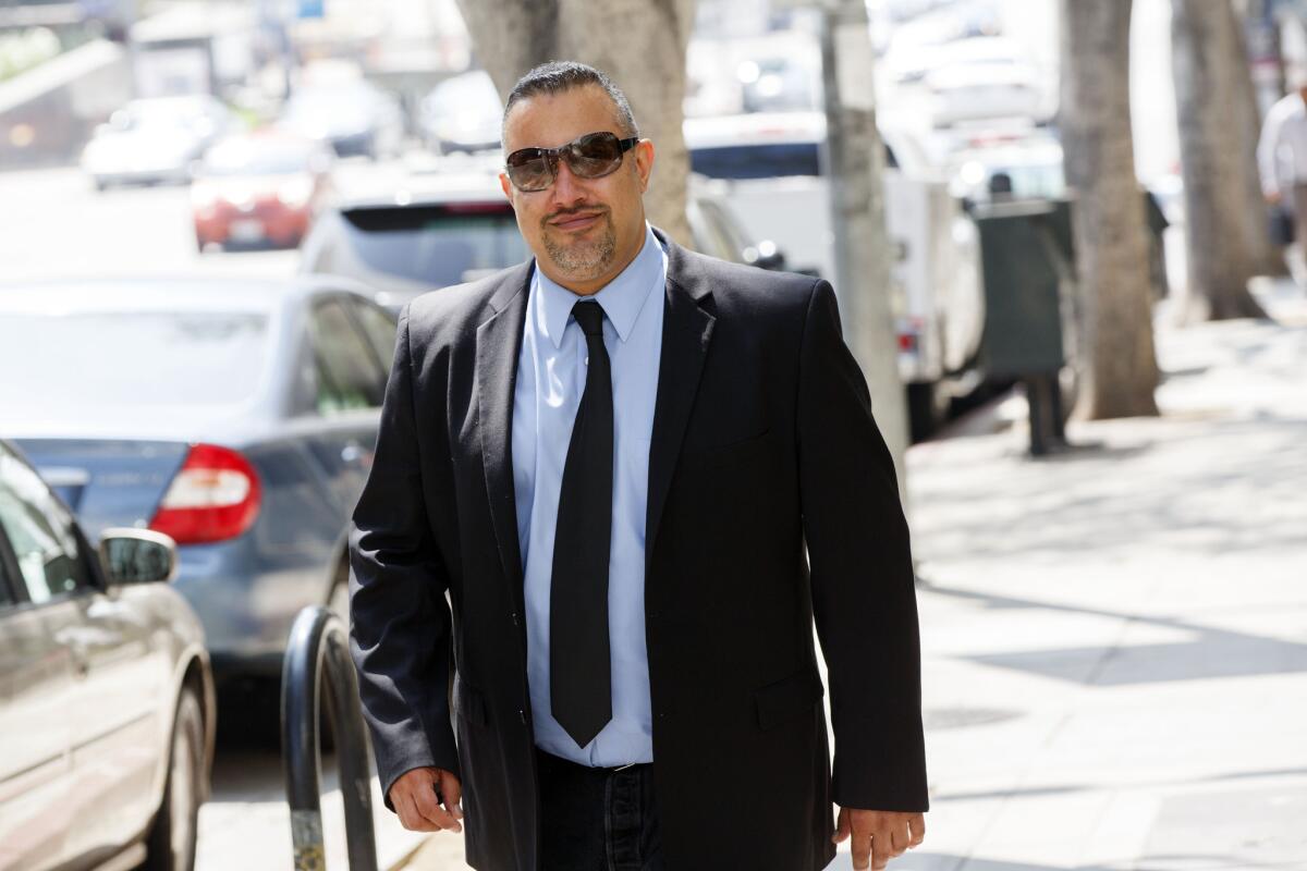 Rave promoter Reza Gerami leaves a downtown Los Angeles courthouse after a hearing earlier this week in the L.A. Coliseum corruption case, in which he is accused of bribery and conspiracy to commit embezzlement.