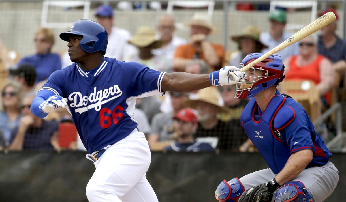 Dodgers right fielder Yasiel Puig, shown hitting against the Cubs on March 18, hit his fourth home run of the spring on Wednesday against the Padres.