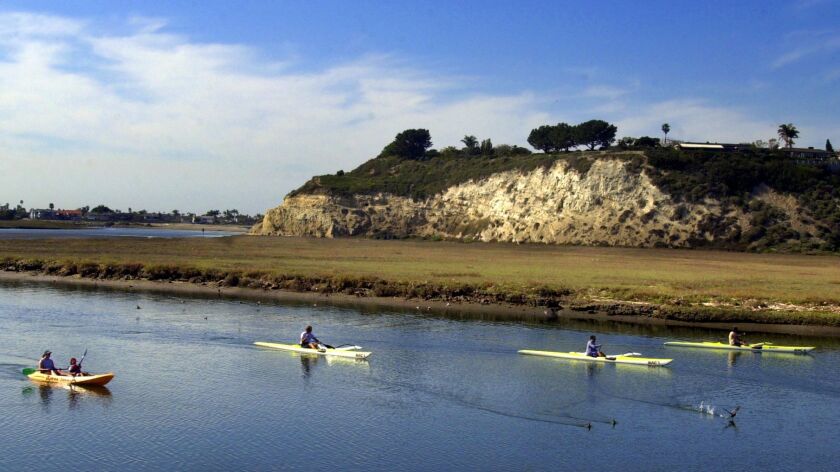 Kayakers float in the calm waters of the Newport Back Bay in 2003.