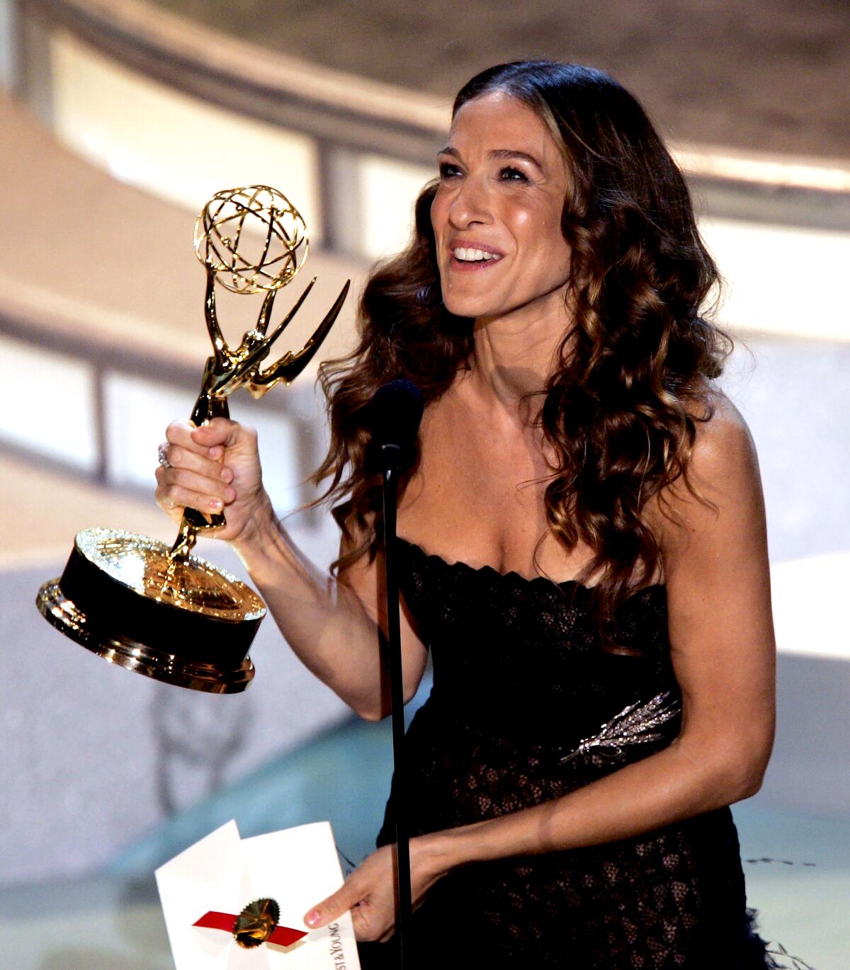 Sarah Jessica Parker holds her Emmy Award onstage in 2004.