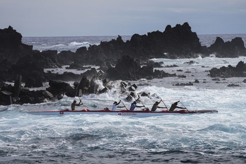 Crew members train for the Hoki Mai challenge, a voyage that covers almost 500 kilometers, or about 300 miles across a stretch of the Pacific Ocean, in Rapa Nui, a territory that is part of Chile and is better known as Easter Island, Thursday, Nov. 24, 2022. The canoe voyage of 12 crew members, nine Rapanuis, two Chileans and one Hawaiian, seeks to raise awareness about the importance of women in the world, urge protection of the environment, and celebrate the union of the islands of Polynesia. (AP Photo/Esteban Felix)