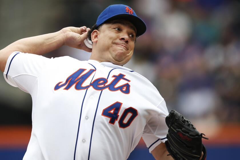 New York Mets starter Bartolo Colon delivers a pitch against the San Francisco Giants on Aug. 3. The Angels reportedly did not try to claim Colon off waivers.