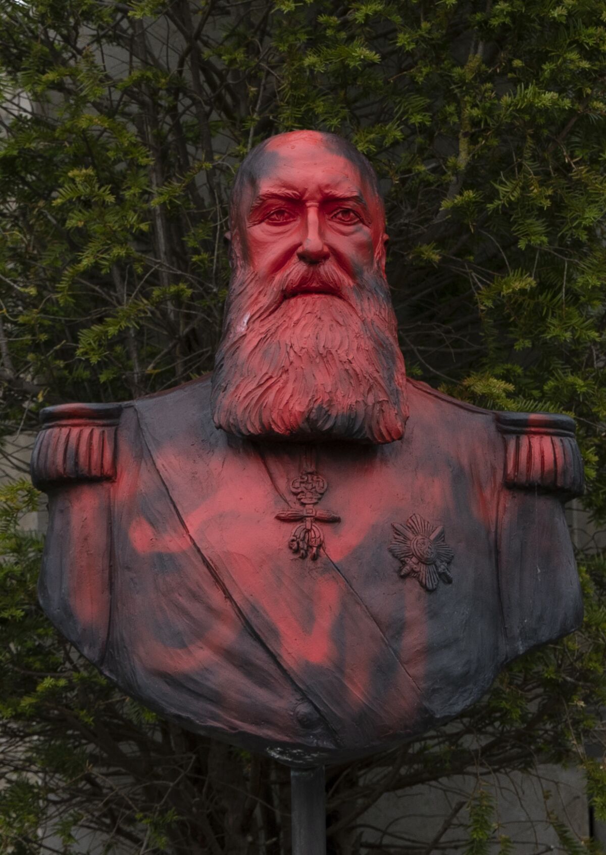 A bust of Belgium's King Leopold II is smeared with red paint and graffiti in Tervuren, Belgium, on June 9, 2020. 