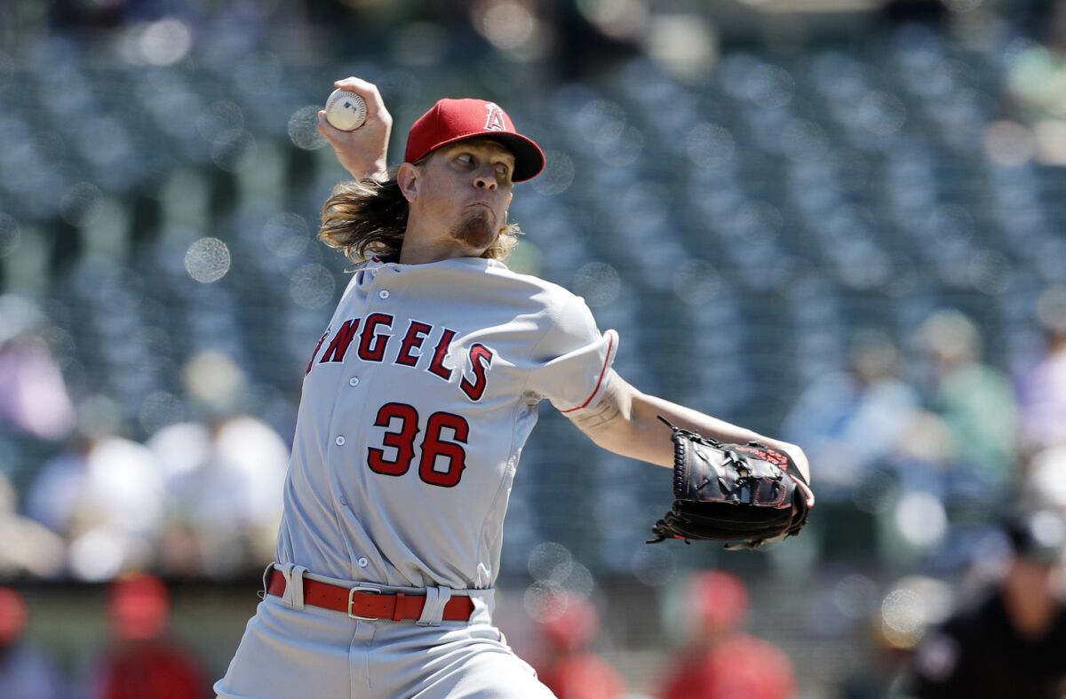 Angels' Jered Weaver pitches against Oakland on Sept. 5.