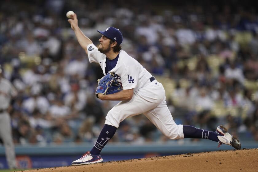 Los Angeles Dodgers starting pitcher Trevor Bauer throws against the San Francisco Giants during the third inning of a baseball game, Monday, June 28, 2021, in Los Angeles. (AP Photo/Jae C. Hong)