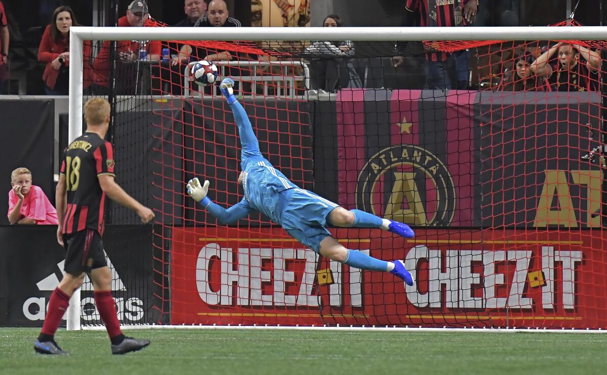 Atlanta United goalkeeper Brad Guzan (1) is not able to stop a goal by Toronto FC midfielder Nick DeLeon, not seen, during the second half of the MLS soccer Eastern Conference final Wednesday, Oct. 30, 2019, in Atlanta. Toronto FC won 2-1. (Hyosub Shin/Atlanta Journal-Constitution via AP)