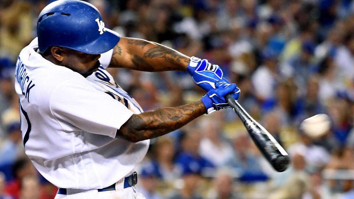 Dodgers second baseman Howie Kendrick connects for a two-run double against the Giants in the third inning Wednesday.