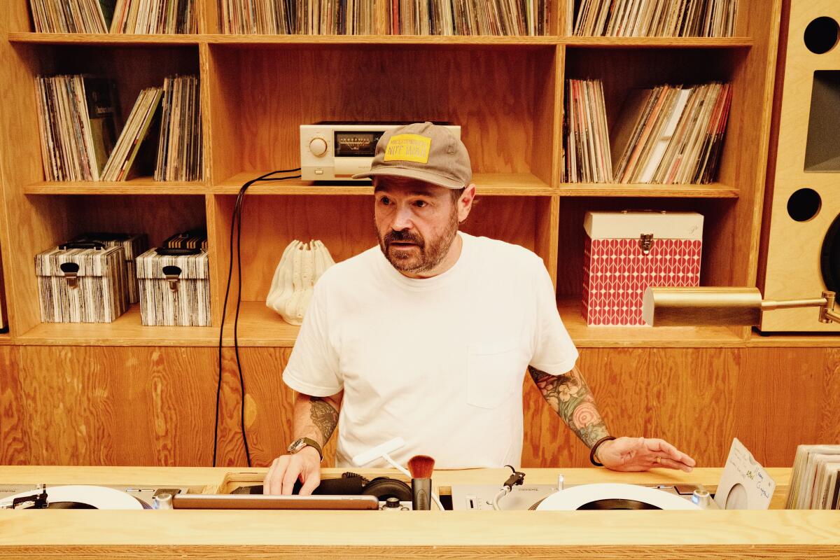 Brock in the DJ booth of his West Hollywood restaurant and listening lounge.