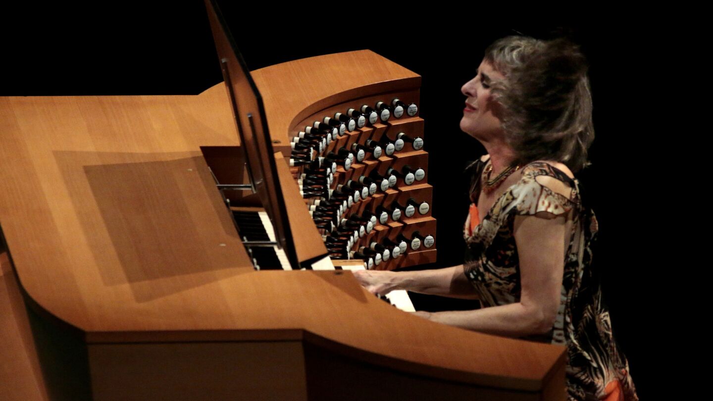 Organ soloist Cherry Rhodes concentrates at the "Hurricane Mama' organ console.