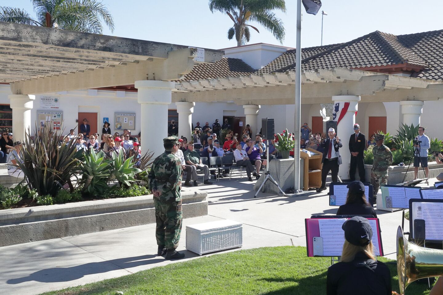 Randy Treadway releases a dove at the Solana Beach Veterans Day Program