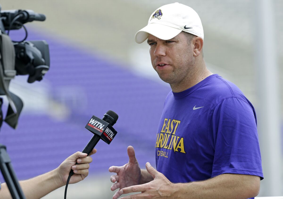Dave Nichol is interviewed during East Carolina's media day.
