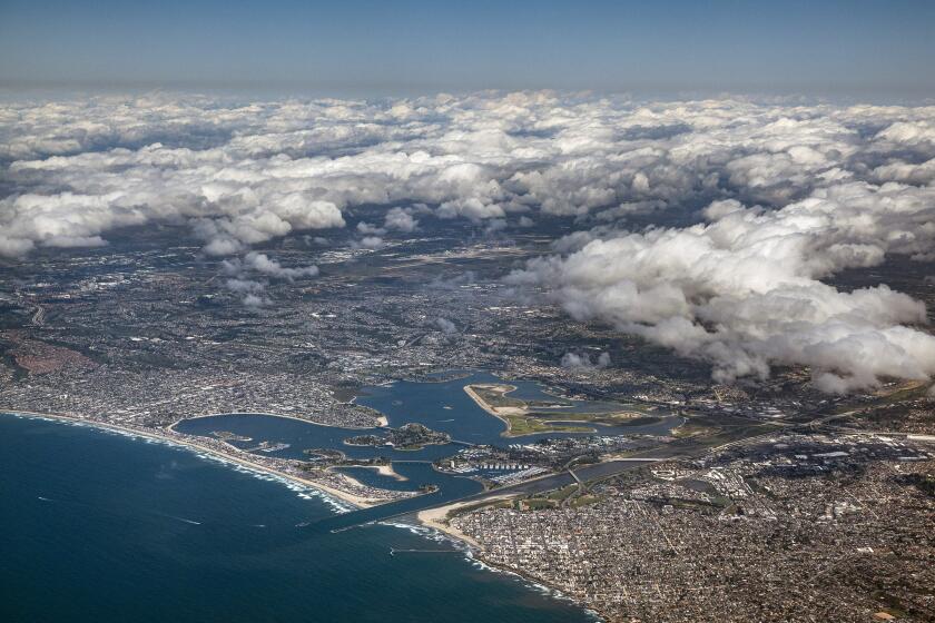 San Diego CA - March 26: Cloulds cleared out along the San Diego coastline after a morning drizzle on Tuesday, March 26, 2024. Ocean Beach and Mission Bay can be seen in the foreground. (K.C. Alfred / The San Diego Union-Tribune)