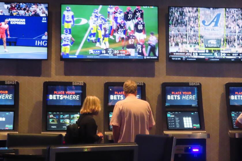 A customer makes a sports bet at the Ocean Casino Resort in Atlantic City, N.J. on Sept. 6, 2022. In the fifth year of legal sports betting in most U.S. states, the action is speeding up due to microbetting, the ability to place a bet on an outcome as narrowly targeted as the result of the next pitch in baseball or the next play in football. (AP Photo/Wayne Parry)