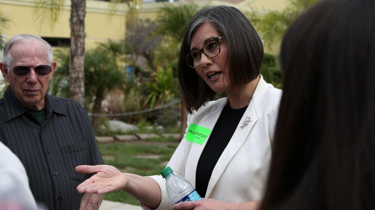 Monica Rodriguez meets with voters in Lakeview Terrace in February. Unofficial results from Tuesday's election show Rodriguez won the District 7 race, which would make her one of two women on the Los Angeles City Council.