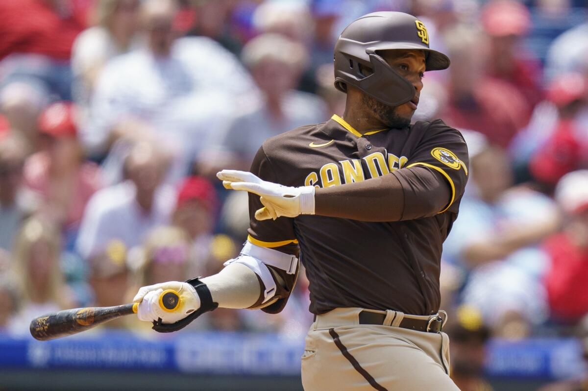 San Diego Padres' Robinson Cano hits an RBI single to score Jurickson Profar during the fourth inning of a baseball game against the Philadelphia Phillies, Thursday, May 19, 2022, in Philadelphia. The Padres win 2-0. (AP Photo/Chris Szagola)