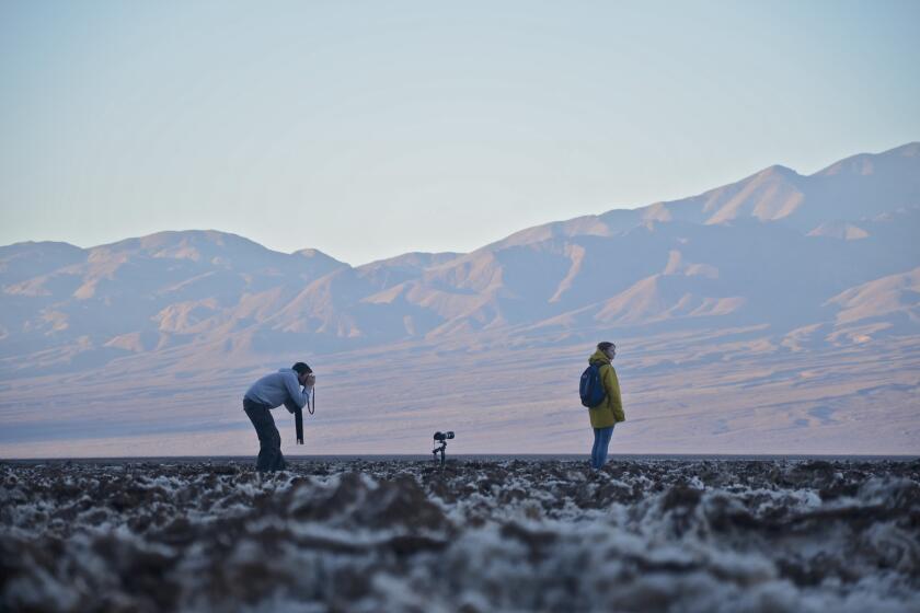 Badwater, about 17 miles south of Furnace Creek Ranch, is the lowest point in Death Valley, and in North America. The valley floor's salty crust crunches underfoot.