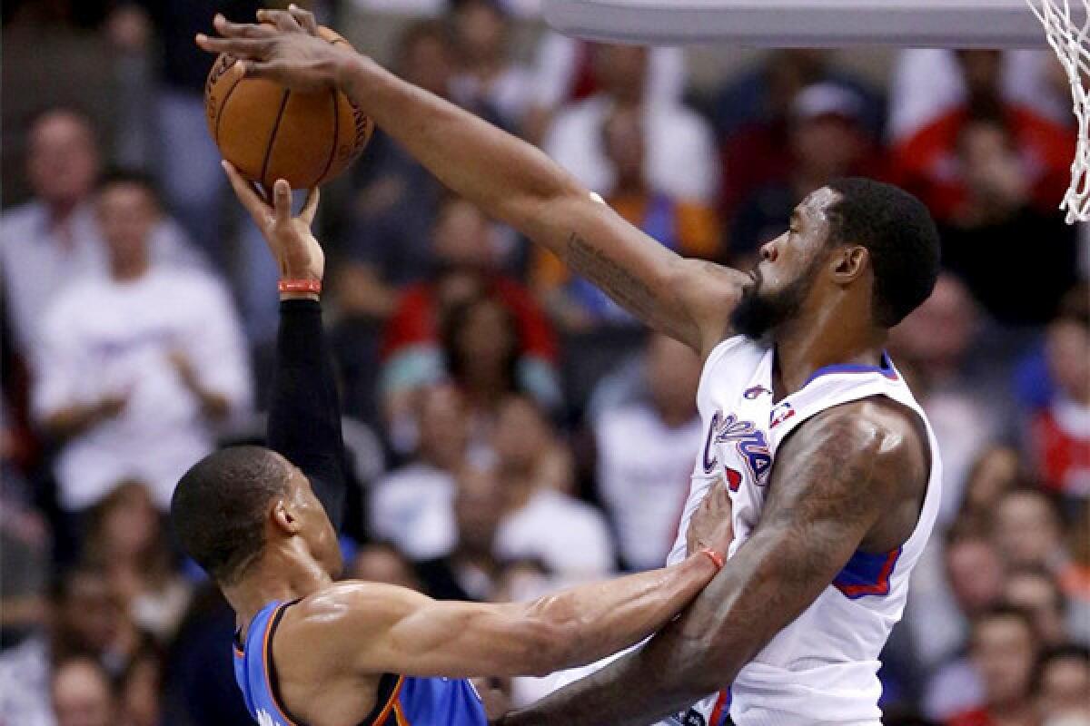 DeAndre Jordan blocks Oklahoma City guard Russell Wilson's shot during the first half of the Clippers' 107-101 loss Wednesday to the Thunder.