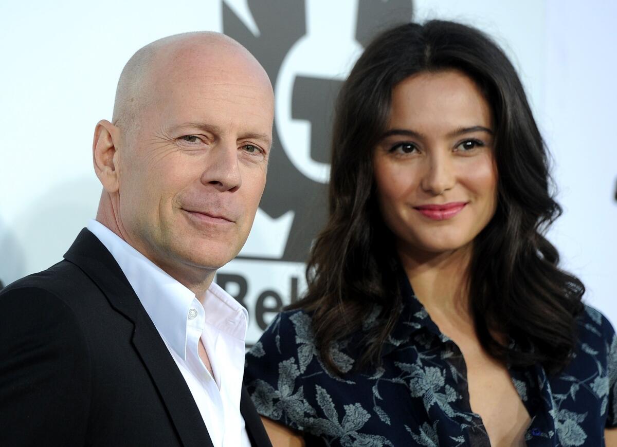Bruce Willis and wife Emma Heming-Willis arrive at the premiere of "The Expendables" in Hollywood.