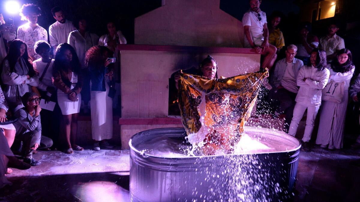 Patrisse Cullors performs at her thesis solo show.