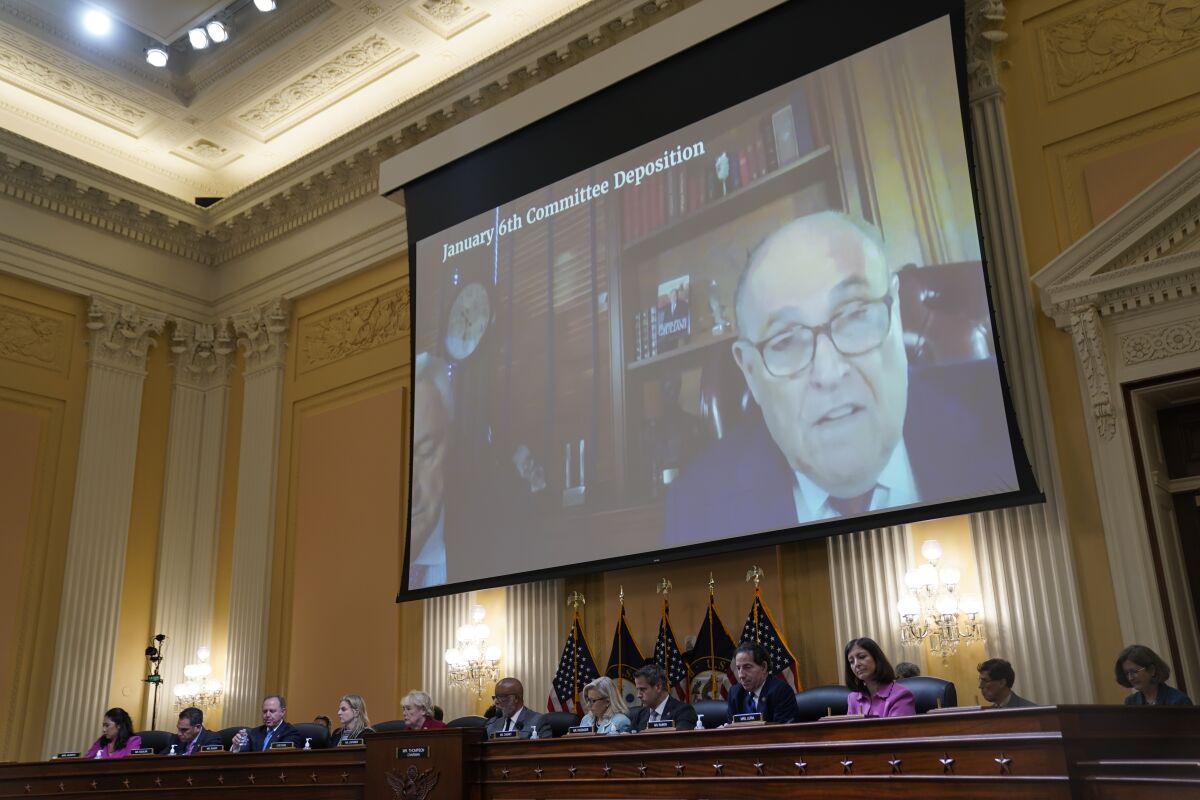 Rudolph Giuliani onscreen during a House hearing