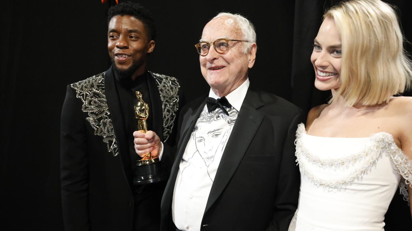 James Ivory with presenters Chadwick Boseman, left, and Margot Robbie after winning for adapted screenplay for "Call Me by Your Name" backstage at the 90th Academy Awards on Sunday at the Dolby Theatre in Hollywood.