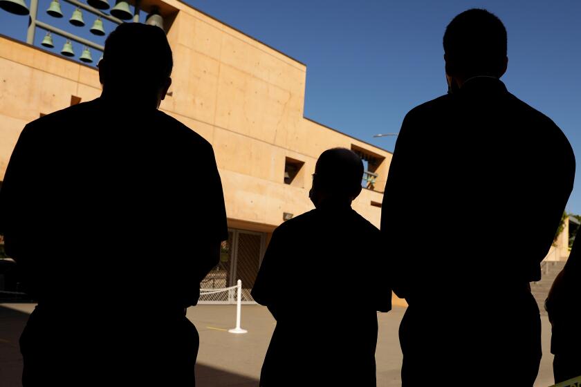 LOS ANGELES, CA - JUNE 9, 2020: Clergy of the Cathedral of Our Lady of the Angels stand quietly in the courtyard for eight minutes and 46 seconds to coincide with the beginning of George Floyd's funeral in Houston, in downtown Los Angeles, California on Tuesday, June, 9, 2020. (Christina House / Los Angeles Times)