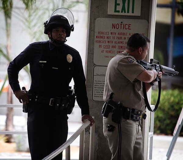 Law enforcement officers take up a position on the Santa Monica College campus.